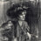 Albert Belleroche - Gildys - woman wearing a large hat  dark background - detail